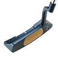 A close-up of the Odyssey Ai-ONE Milled Two-T CH Putter by Odyssey, featuring a dark metallic head, gold-colored face, and Dual Fang Design for increased forgiveness.