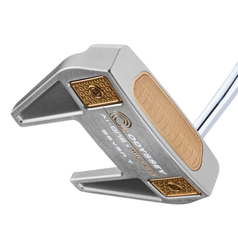 A close-up of the Odyssey Ai-ONE Silver Milled Seven T DB Putter shows its high-MOI mallet shape, silver and gold design with textured gold and bronze inserts, and engraved Odyssey branding.