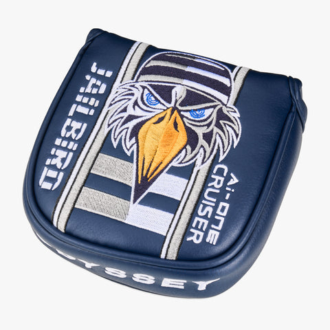 A blue Odyssey headcover with an embroidered cartoon eagle in a striped prison cap, designed for fans of the Odyssey Ai-ONE Square 2 Square Jailbird Broomstick Putter and putters with AI-powered face tech.