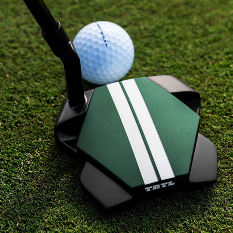 Odyssey TRTL Crank Hosel putter with a golf ball, showing the face insert and Twin Track lines