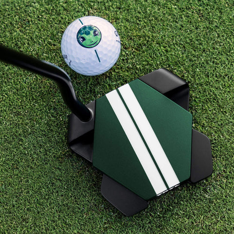 Odyssey TRTL Double Bend putter behind a golf ball on the green, showing Twin Track alignment