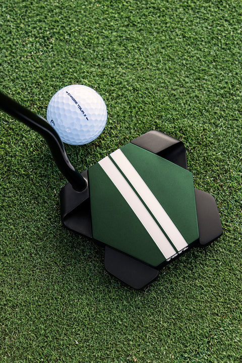 Odyssey TRTL Max Cruiser putter at address beside a ball on the green