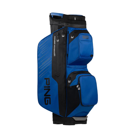 The PING 2025 Pioneer Monsoon Cart Bag in royal blue/black/white features multiple zippered pockets, a side handle, and a vertical Ping logo; this waterproof golf bag is ideal for all weather.