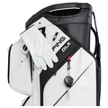 A white Ping 2026 DLX 244 Cart Golf Bag with a golf glove draped on the side and a car key attached to the front pocket, highlighting its tour-level cart design.