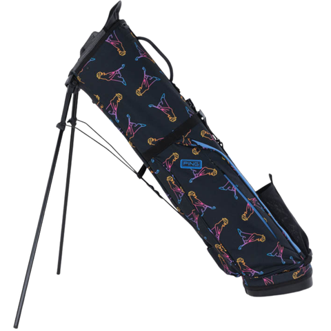 A grey PING 2026 Moonlander Stand Bag from Ping stands upright on carbon fiber legs. This lightweight golf bag features the Ping logo near the top.