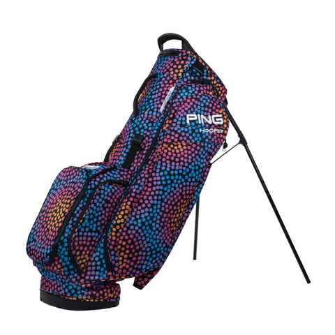 The PING Hoofer 231 Stand Bag | Mosaic by Ping features a vibrant dot pattern and sturdy black legs—a lightweight, colorful golf bag designed to add flair and function to your game.