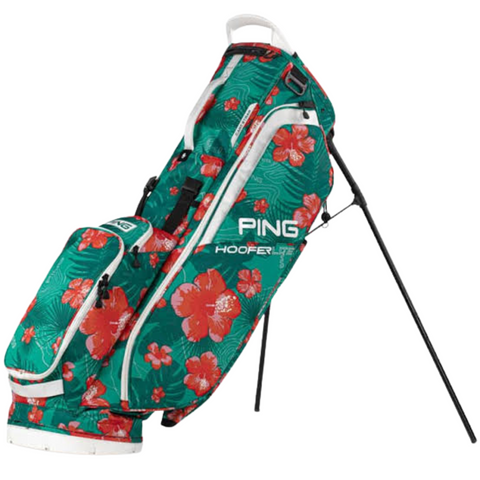 The limited edition Ping Hoofer Lite 231 Stand Bag | PUA comes in green with white accents and a red and white hibiscus floral pattern. This lightweight golf bag features multiple zippered pockets and two extended stand legs.