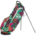 The PING Hoofer Lite 231 Stand Bag | Watermelon by Ping features a vibrant red, green, black, and pink geometric pattern with dots and stripes. Lightweight and stylish, it offers a stand plus multiple convenient pockets.