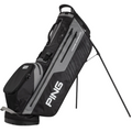 The black and gray Ping Hoofer Monsoon Stand Bag features a stand, multiple zippered pockets, waterproof design, and the prominent Ping logo on the side.