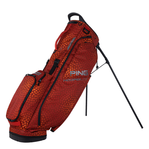 The PING HooferLite 231 Stand Bag in Rust Mosaic features a honeycomb pattern, black trim, logo, padded shoulder strap, zippered compartments, and stands upright on two metal legs.