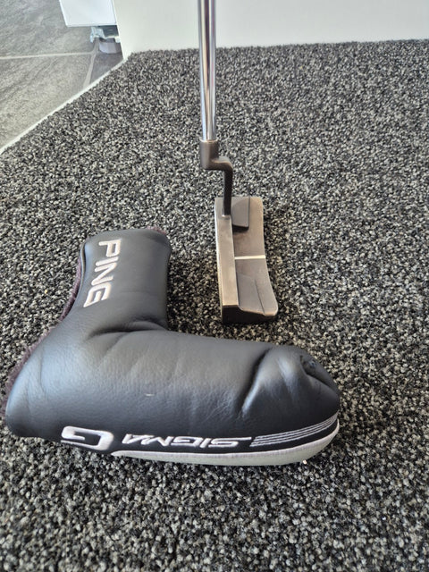 Close-up of left-handed PING Sigma G Kinloch CB putter and worn included headcover