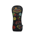 The PRG Originals 2025 Neon Vegas Driver Headcover features durable black leatherette and eye-catching Las Vegas embroidery, including dice, poker chips, cards, cherries, the Vegas sign, and a bold red 777.