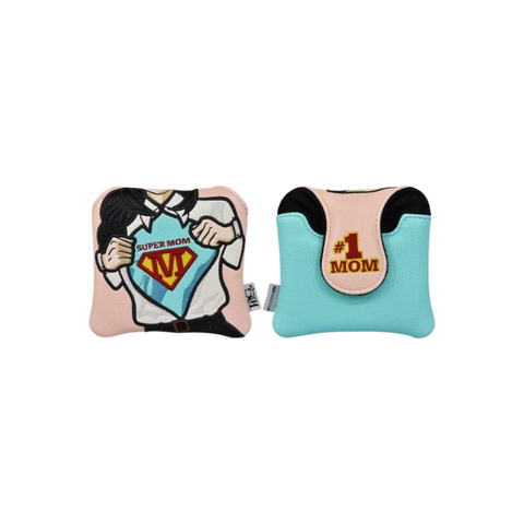 A pair of soft, colorful pillows: one shows a cartoon figure opening a shirt to reveal a Super Mom emblem—echoing the PRG Originals 2025 Super Mom Mallet Putter Cover by PRG—while the other is blue with #1 MOM on a yellow patch.