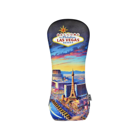 The PRG Originals 2025 Vegas Strip Driver Headcover by PRG features the iconic Welcome to Fabulous Las Vegas sign and a vibrant sunset cityscape of casinos and landmarks along the Strip.