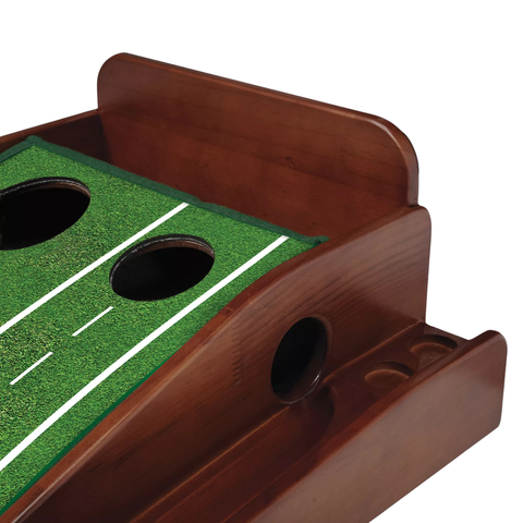 A close-up of the Perfect Practice v.5 Standard Pro Putting Mat by Perfect Putting, featuring artificial turf with three holes and white yard lines—ideal for indoor golf practice and a realistic putting experience.