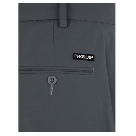 Close-up of ProQuip Winter Tech Mens Trousers in gray, featuring a buttoned pocket and a small black and white Proquip logo patch above it. The smooth, structured fabric is perfect for staying warm on the course.