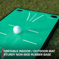 A white golf ball sits on the green Rukket Pathfinder Impact Swing Trainer by Rukket, featuring a sturdy non-skid rubber base and printed markings for indoor or outdoor golf training.