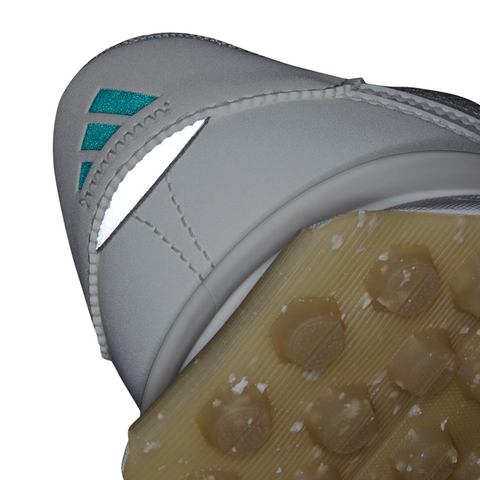 Close-up of the S2G 24 Women's Golf Shoes by Golf 360 in Off White, Pure Teal, and Alumina, highlighting the spikeless sole with textured studs and white-teal details