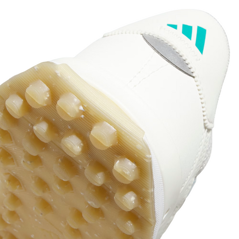 Close-up of the Golf 360 S2G 24 Women's Golf Shoes in Off White/Pure Teal/Alumina, showcasing a pale studded rubber outsole and teal accents