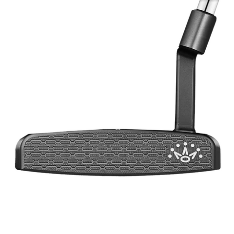 Close-up of the Scotty Cameron 2025 Limited Edition Phantom Black 9.2R Putter head, showing its textured, patterned face and a small white crown logo. The angled shaft is partially visible.