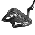 A Scotty Cameron 2025 Limited Edition Phantom Black 9.2R Putter is seen from a low angle on a white background, showcasing its black finish, textured face, silver weights, and distinctive angled shaft design.