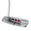 The Scotty Cameron 2025 Studio Style Catalina Putter features a silver finish, three red circular inlays, and MILLED IN USA engraved above them, highlighting Scotty Camerons precision-milled stainless steel craftsmanship.