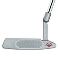 A close-up of the Scotty Cameron 2025 Studio Style Newport 2 Plus Putter head shows its precision milled, textured face with a red logo in the corner, attached to a chrome shaft.