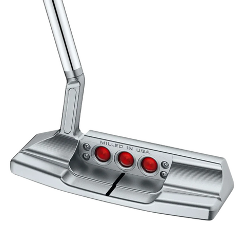 The Scotty Cameron 2025 Studio Style Newport 2.5 Plus Putter features a silver, precision-milled head with three red circular inlays and Milled in USA engraved above, plus an angled shaft characteristic of the Newport 2.5 Plus design.