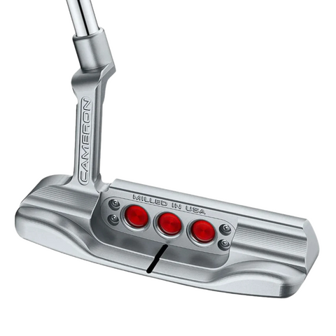 The Scotty Cameron 2025 Studio Style Newport Plus Putter features a silver finish, three red circular accents on the back, a black alignment line, “Milled in USA” engraving above the accents, and an angled shaft for precision performance.
