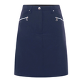 The Sporte Leisure Women’s Core Skort is a navy blue A-line golf skort with two front white diagonal zippered pockets and a button waistband closure.