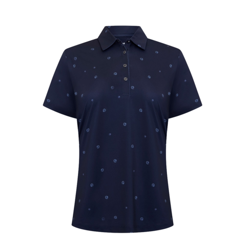 The Greg Norman Sporte Leisure Women’s Pearlet Polo in French Navy features a collar, button placket, moisture-wicking fabric, and an all-over subtle small circular dot pattern.