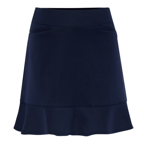 The Sporte Leisure Womens Skort with Frill in navy features a fitted waistband, discreet side pockets, and a subtle frilled hem for sporty elegance.