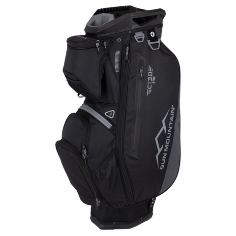 The Sun Mountain C-130 Sync Cart Bag 2024 is a black golf bag with multiple zippered pockets, a large side logo, and a top handle, designed for organizing clubs and accessories on a push cart.