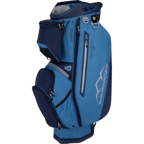 The Sun Mountain C-130 Sync Cart Bag 2024 by Sun Mountain features blue and navy colors, multiple zippered pockets, a sturdy base, top handle, and displays the logo on the side.