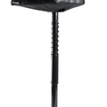 The Sun Mountain Pathfinder Trundler Seat by Sun Mountain is a black, height-adjustable standing stool with a contoured seat, telescoping central support, and flat base, designed for ergonomic support while standing or leaning.