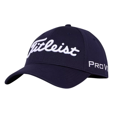 The Titleist 2024 Tour Elite Cap is a navy blue, tour-level golf hat with a white embroidered Titleist logo on the front and Pro V1 on the side, shown angled to the left.