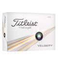 A box of Titleist 2024 Velocity Golf Balls in White, featuring the “#1 ball in golf” label, is designed for long-distance performance and displays silver and gold streaks with a black, green, and silver circle on the mostly white packaging.