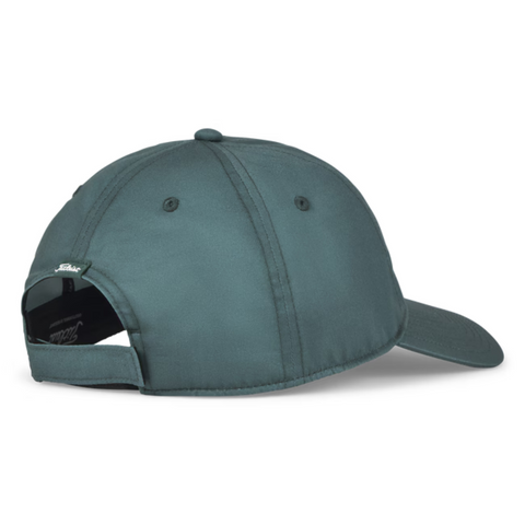 The Titleist 2025 Montauk Lightweight Cap in dark green features a curved brim, stitched panels, ventilation eyelets, and an adjustable strap with metal clasp—ideal for stylish comfort on or off the course.