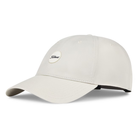 The Titleist 2025 Montauk Lightweight Cap is a light beige golf hat with a curved brim, small oval logo patch, and adjustable strap—ideal as a stylish golf cap NZ option.