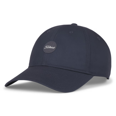 The Titleist 2025 Montauk Lightweight Cap is a navy blue hat with a curved brim and a front round patch featuring the white Titleist script logo—ideal as your go-to golf cap in NZ.