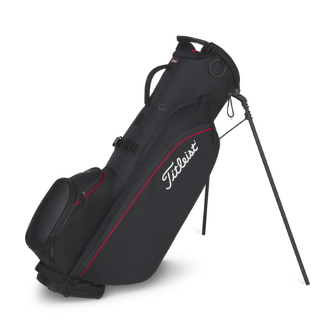 The Titleist 2025 Players 4 Carbon Stand Bag in Black/Black/Red features ultra-light carbon fiber legs, multiple zippered compartments, an extended stand for support, and a top carrying handle.