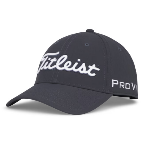 The Titleist 2025 Tour Performance Cap is a dark gray golf hat with white Titleist script on the front and Pro V1 on the side. It features a curved brim and ventilation holes for comfort during play.