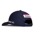 The Titleist 2025 Tour Performance Cap is a navy blue hat with Titleist stitched on a white and red back patch, Pro V1 embroidered in white on the side, and an adjustable strap closure for comfort.
