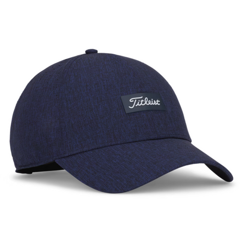The Titleist 2025 Women's Charleston Breezer Cap in Heather Navy features UV protection, a curved brim, and a black Titleist logo patch—an ideal choice for women's golf.