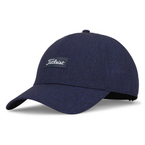The Titleist 2025 Women's Charleston Breezer Cap in Heather Navy features a curved brim, a small Titleist script patch on the front, and provides stylish comfort with UV protection—perfect for sunny days on the golf course.