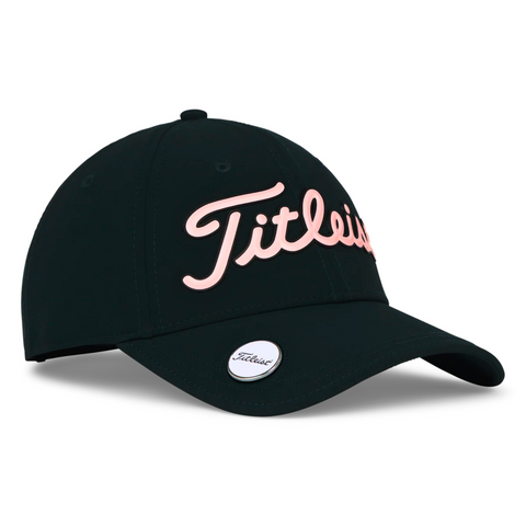 The Titleist 2025 Players Performance Ball Marker Women’s Cap is black with pink cursive branding and a small round patch featuring a built-in magnetic ball marker on the bill.