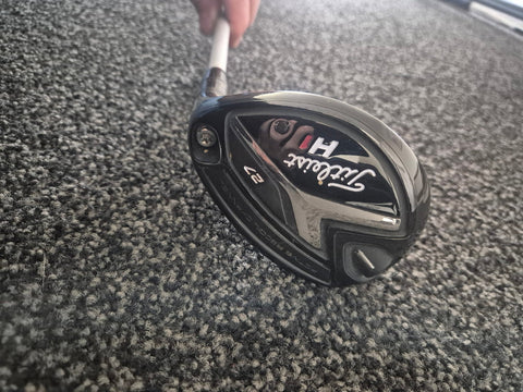 Used Titleist 818 H1 27 degree right-handed hybrid sole showing condition
