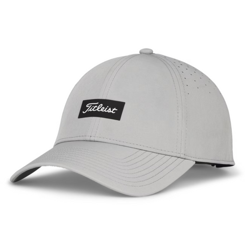 The Titleist Charleston Breezer Cap in grey/black/white is a lightweight golf hat with a curved brim, black patch with white Titleist logo, and side ventilation holes for breathable comfort.