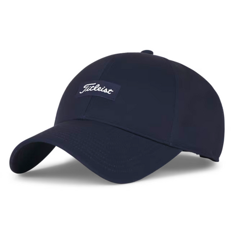 The Titleist Charleston Breezer Cap in Navy/White features a curved brim and a front patch with Titleist in white script—a stylish, breathable golf hat ideal for any golfer.