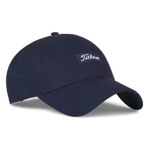 The Titleist Charleston Breezer Cap in Navy/White features a curved brim, breathable design, and a small white Titleist logo on the front—ideal for long days on the golf course.